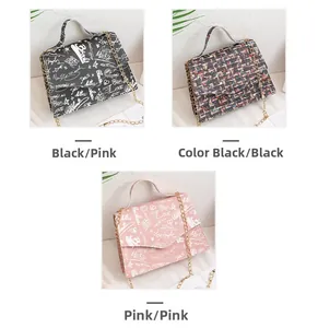 Detailed view of three mini chain bags in black, multi-black, and pink graffiti patterns