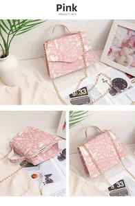 Pink printed crossbody chain bag with graffiti patterns and gold hardware detail