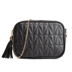 Quilted black leather crossbody bag with golden chain strap and tassel detail