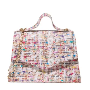 Women's colorful tweed flap handbag with gold chain strap and top handle on white base