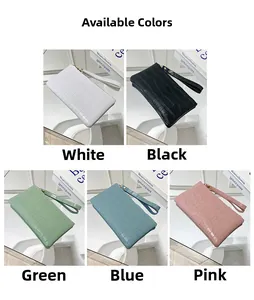 Detail view of colorful crocodile pattern wristlet bags in five vibrant pastel shades