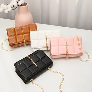 Quilted crossbody bags with gold tassels and chain straps in four elegant colors