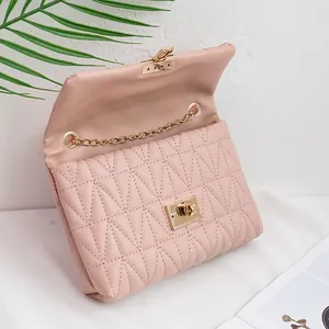 Elegant quilted crossbody bag in pink with gold chain strap and square lock closure