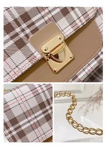 Detail of plaid bag showing gold twist lock, metal chain strap and fine stitching