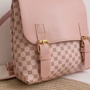 Pink checkered mini backpack for women with dual gold buckles and floral pattern