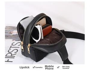 Internal storage detail of the double zipper mini cross body bag with daily essentials