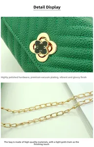 Close-up of green leather bag featuring a gold clover swivel lock and metal chain strap