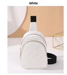 Detail of white PU leather crossbody bag with quilted diamond pattern and black strap