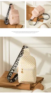 Detail of pink geometric and white patterned chest bags with wide letter straps