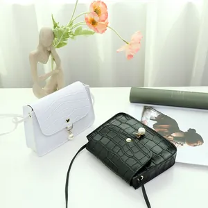 Elegant stone pattern crossbody bag with pearl pendant in black and white styles