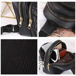 Black quilted waist bag for women with gold zippers and breathable mesh back view
