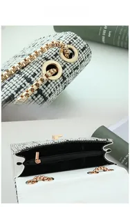 Detail view of woven tweed chain bag with gold hardware and interior zipper pocket