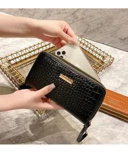 Detailed view of crocodile texture wallet showing large capacity for smartphone storage