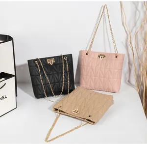 Three quilted chain bags in black, pink, and beige with elegant metal locks