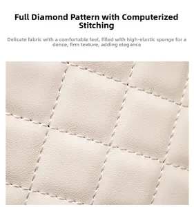 Close-up of beige quilted leather detail with diamond lattice and computer quilting