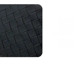 Close-up of premium black woven faux leather texture on a compact coin purse wallet