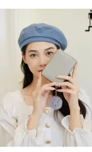 Fashionable light gray woven texture short wallet with a matching fluffy pom-pom charm