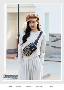 Outdoor shot of a stylish leopard print waist bag with metal plate on beige outfit