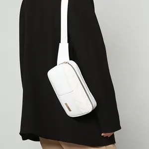 White quilted diamond stitch crossbody bag for women with wide strap and gold hardware