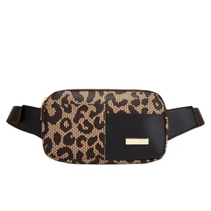 Women's leopard print fanny pack with black leather pocket and golden hardware