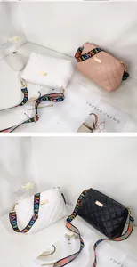Quilted crossbody bag collection in white, pink, and black with colorful LOVE strap