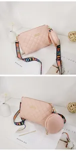 Pink quilted crossbody bag detail with 'LOVE' printed wide strap and round coin purse