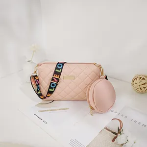 Quilted crossbody bag in light pink with wide letter strap and mini coin purse