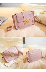 Vues détaillées d'un sac bandoulière rose motif crocodile avec fermoir abeille