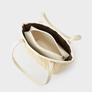 Handcrafted straw tote bag with woven texture, PU shoulder straps and inner zipper pouch