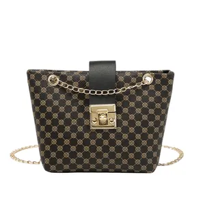 Vintage brown crossbody bucket bag with clover embroidery and gold chain strap