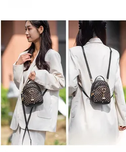 Mini brown floral pattern backpack for women with cat ear hardware and pearl pendant detail