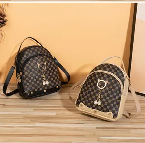 Detail view of mini PU leather backpacks with geometric patterns and pearl cat ear charms