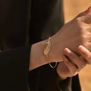 Elegant 18K gold-plated brass feather open bangle for women with intricate texture