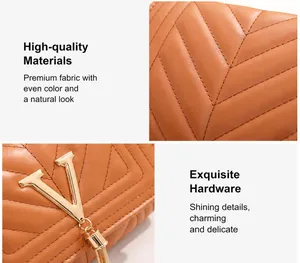 Detail of V-quilted caramel brown leather with gold V-motif hardware and luxury tassels