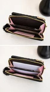 Internal view of a black quilted phone bag showing large capacity storage and pink lining