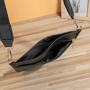 Quilted crossbody bag in black PU leather with gold hardware and wide woven strap