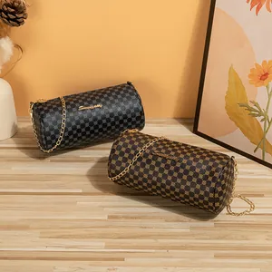 Quilted cylinder chain bags in black and brown with vintage logo and gold hardware