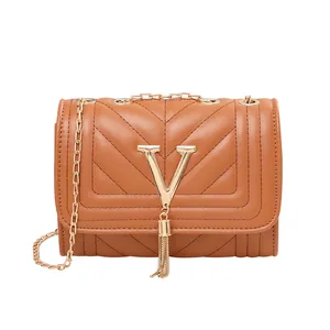 Caramel V-quilted crossbody bag with gold tassel V-logo and chic metal chain strap