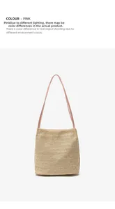 Detail shot of pink straw bucket bag featuring woven texture and slender strap
