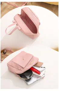 Pink heart-embossed mini backpack with spacious interior for iPad, phone, and makeup