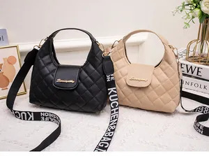 Quilted mini handbags in black and beige with stylish wide patterned shoulder straps