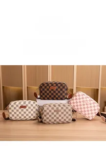 Macro view of checkered camera bags in various colors with textured fabric straps