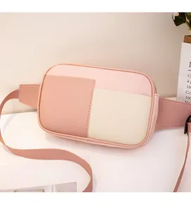 Detailed close-up of multi-color paneled crossbody bag with adjustable nylon strap