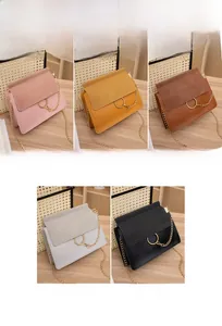 Detailed view of square crossbody bags in five colors with gold ring and chain accents