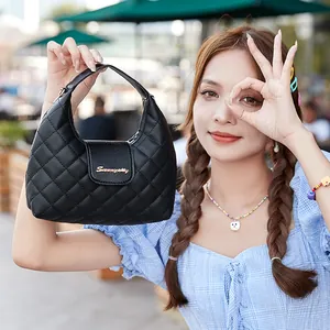 Chic black quilted hobo handbag for women featuring a gold logo and top handle design