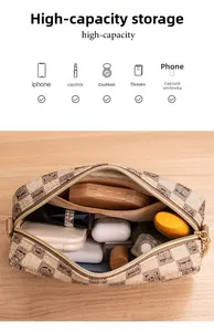 Internal view of high-capacity checkered crossbody bag with multiple daily essentials