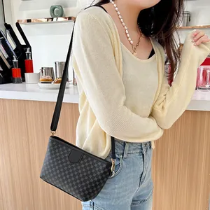 Ladies small square crossbody bag with contrast circle pattern and gold metal hardware