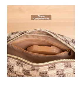 Detail showing internal zipper pocket and classic checkered lining of the small square bag