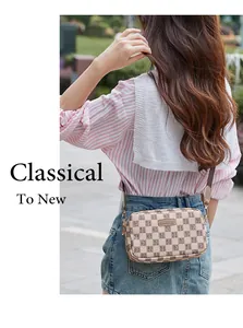 Outdoor shot of a checkered crossbody camera bag with wide fabric strap and zipper
