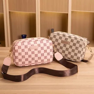 Classic checkered small square camera bags in pink and beige with adjustable straps